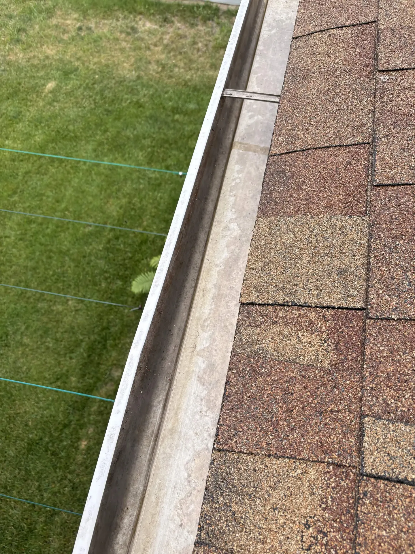 Same gutter run cleaned out and draining freely
